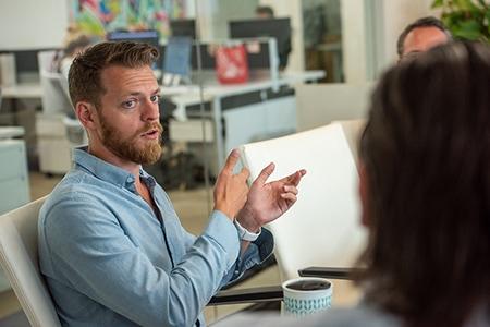 Close up of a project manager talking at a meeting